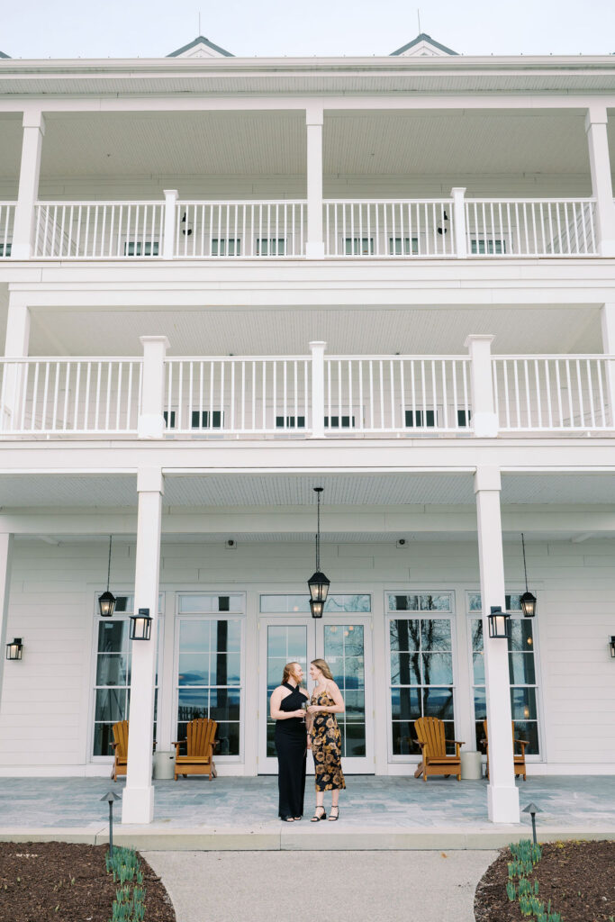 Windy lakeside engagement photos with movement and natural light